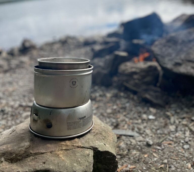 Cooking with a Trangia by a lake